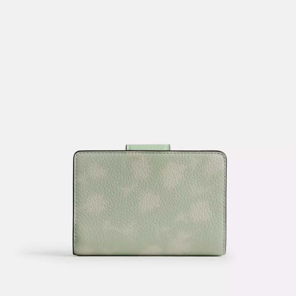 Cartera mediana con cremallera en esquina y estampado floral