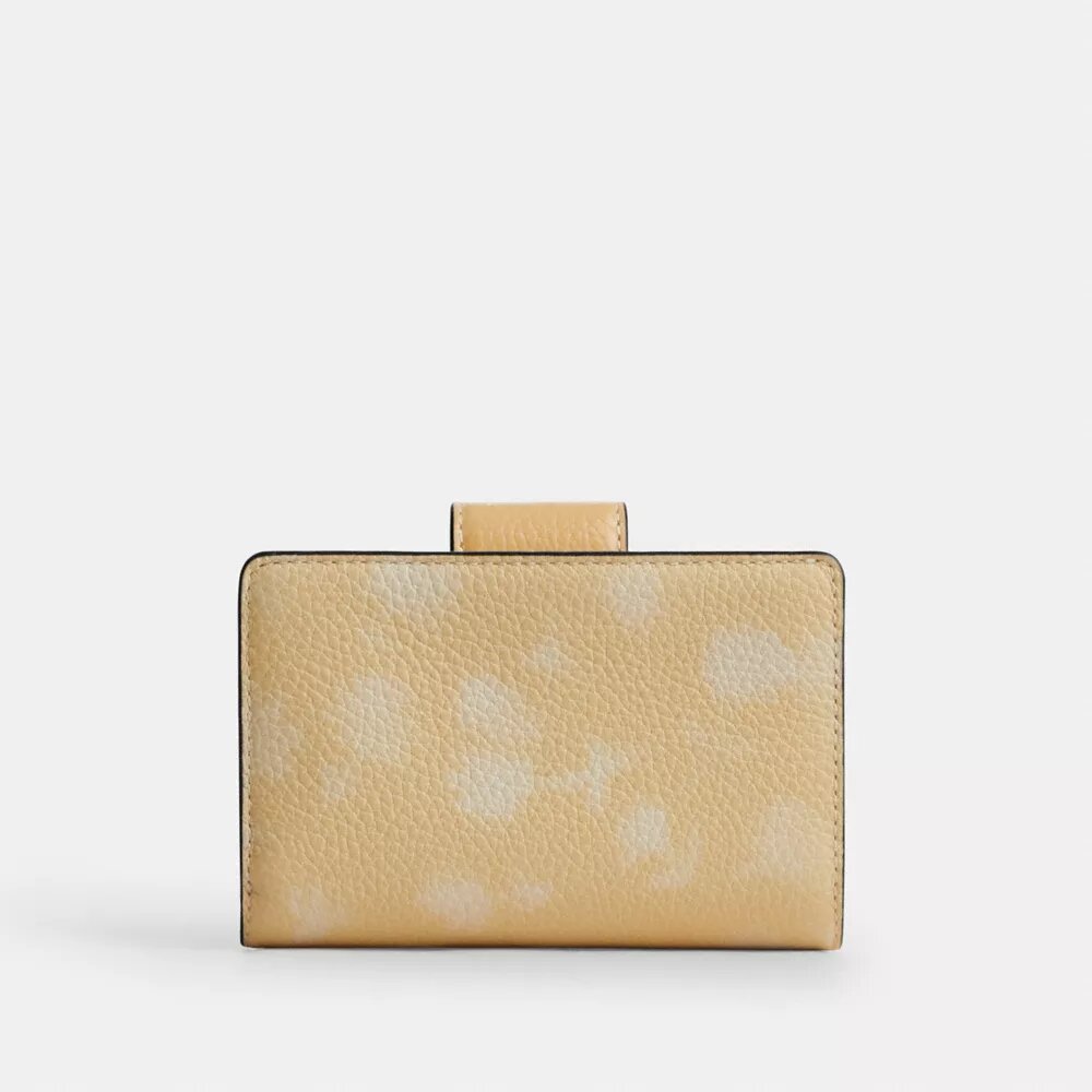 Cartera mediana con cremallera en esquina y estampado floral