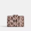 Cartera mediana con cremallera en la esquina