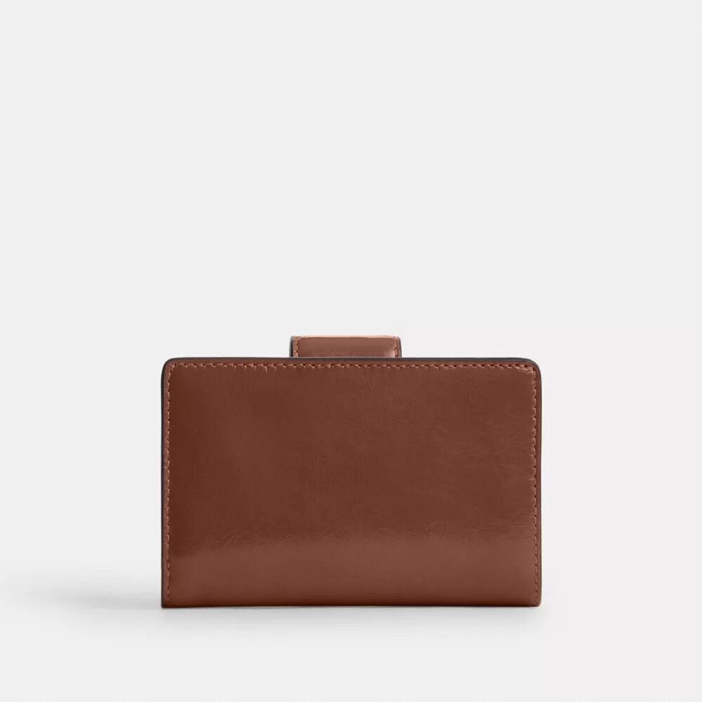 Cartera mediana con cremallera en la esquina