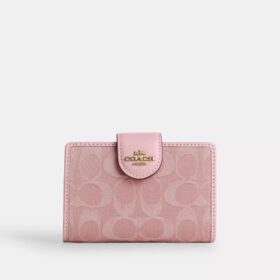 Cartera mediana con cremallera en las esquinas en denim característico