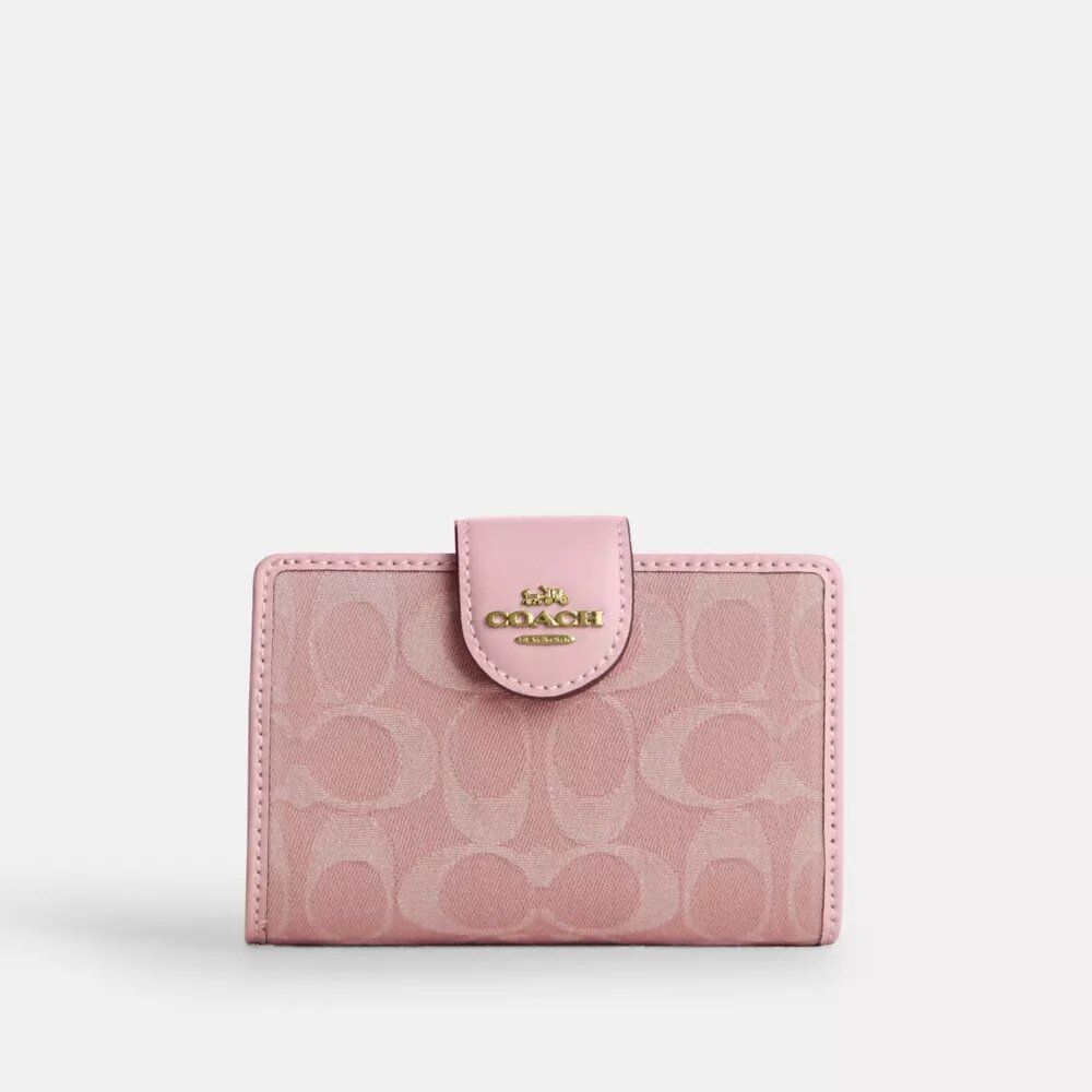Cartera mediana con cremallera en las esquinas en denim característico