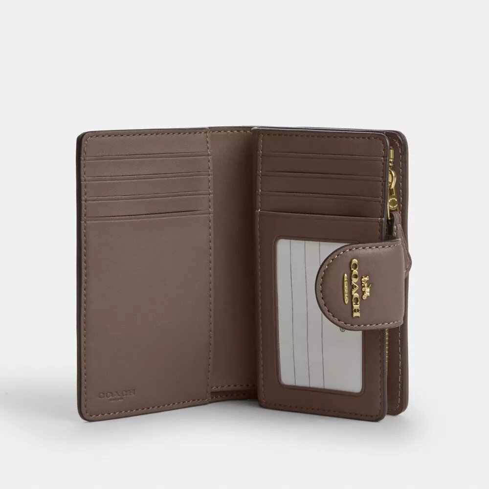 Cartera mediana con cremallera en las esquinas, en jacquard exclusivo con bordado floral
