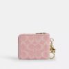 Cartera pequeña con cremallera en esquina, de denim exclusivo con Charms