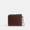 Cartera pequeña con cremallera en la esquina