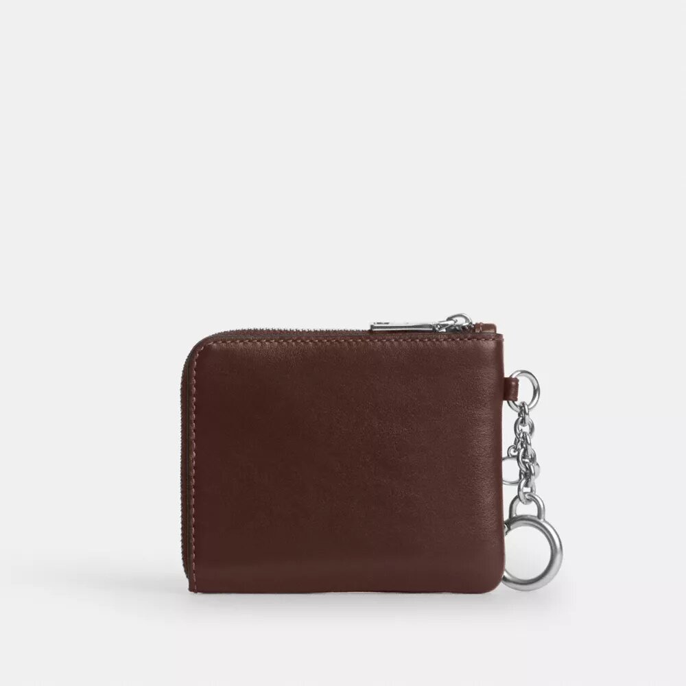 Cartera pequeña con cremallera en la esquina