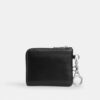 Cartera pequeña con cremallera en la esquina