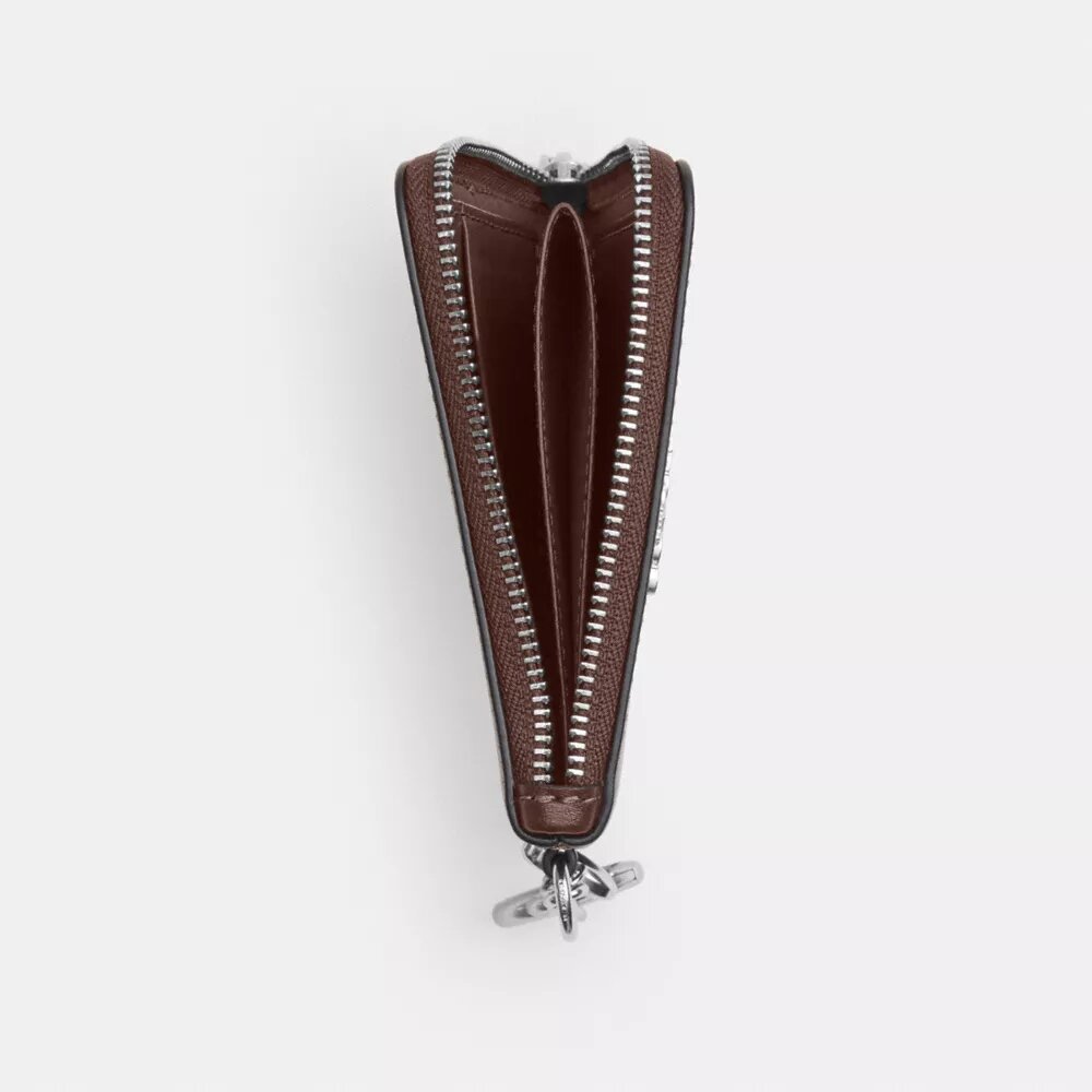 Cartera pequeña con cremallera en la esquina