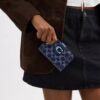 Cartera Tabby en denim característico