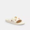 Chanclas deportivas Udele de Disney X Coach con estampado de pegatinas