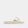 Chanclas deportivas Udele de Disney X Coach con estampado de pegatinas