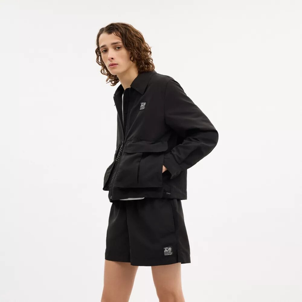 Chaqueta corta tipo cargo con presillas Coachtopia
