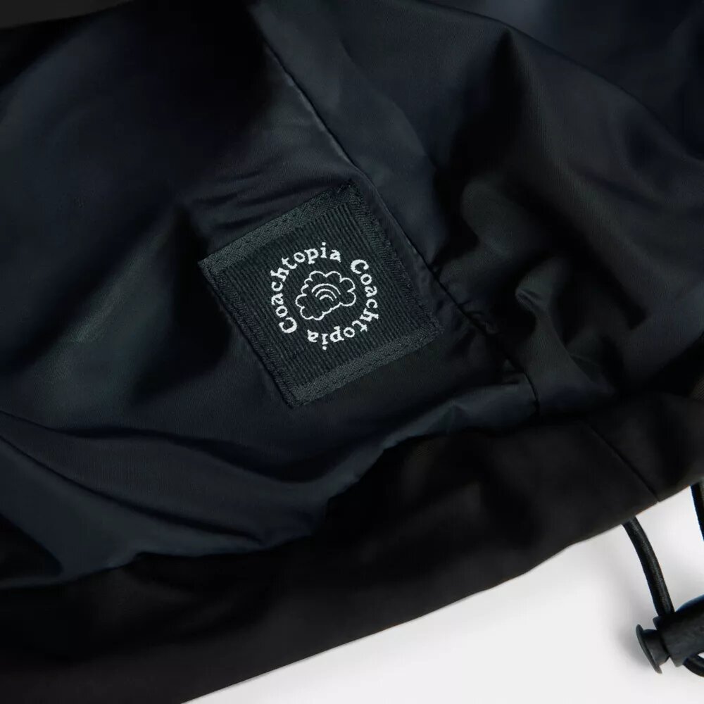 Chaqueta corta tipo cargo con presillas Coachtopia