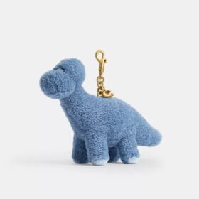 Colgante para bolsos «Buddy Dinosaur» de Rexy, con motivo del 10.º cumpleaños, en piel de oveja