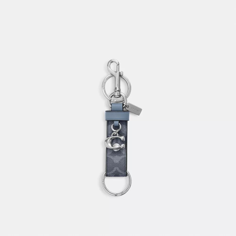 Colgante para bolsos con cierre a presión en Signature Canvas y Charms