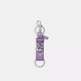 Colgante para bolsos con cierre a presión en Signature Canvas y Charms