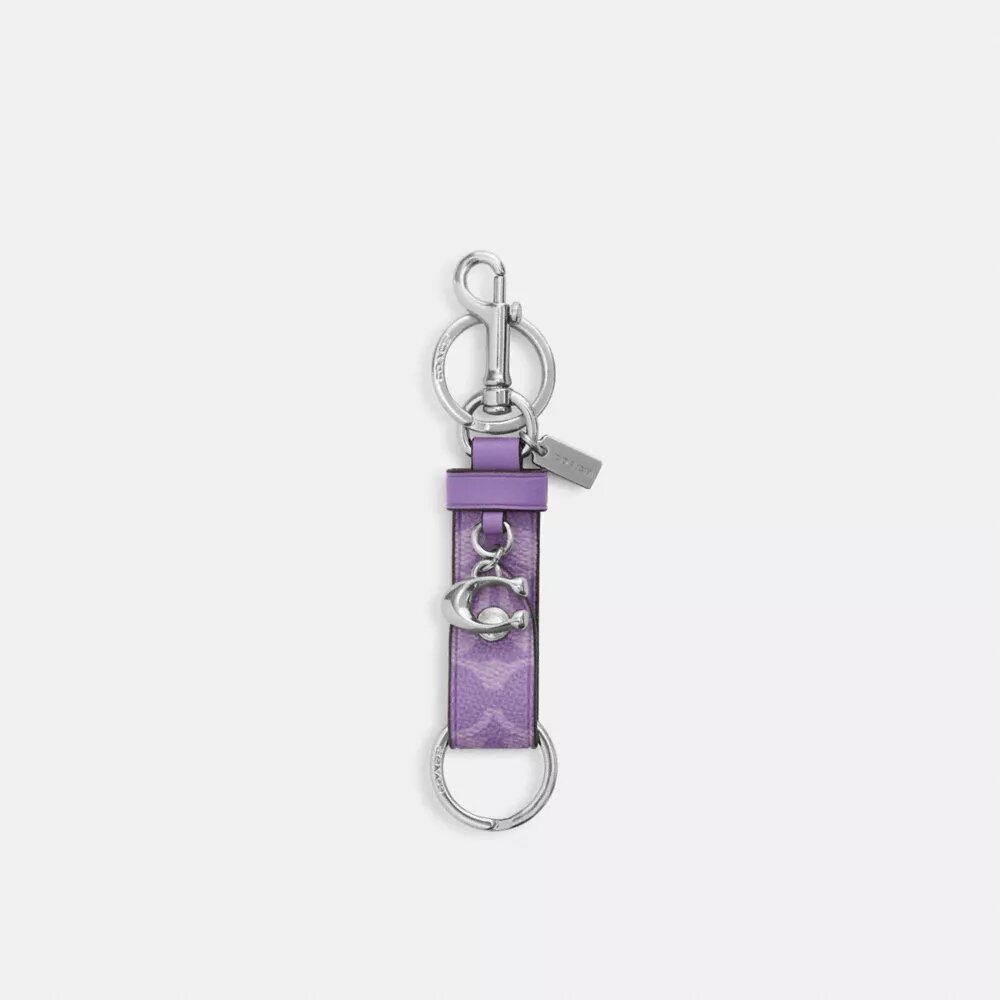 Colgante para bolsos con cierre a presión en Signature Canvas y Charms