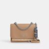 Colgante para bolsos con cierre a presión en Signature Canvas y Charms