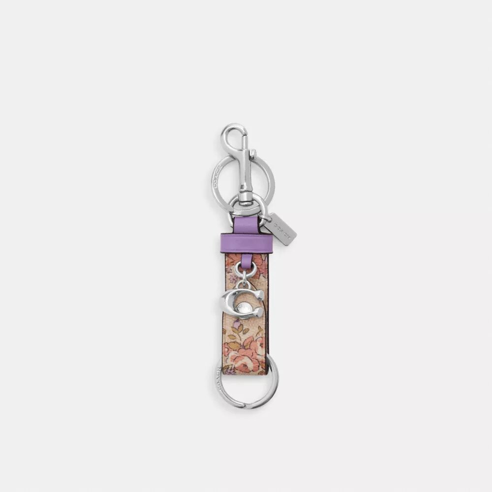 Colgante para bolsos con cierre de presión y estampado floral