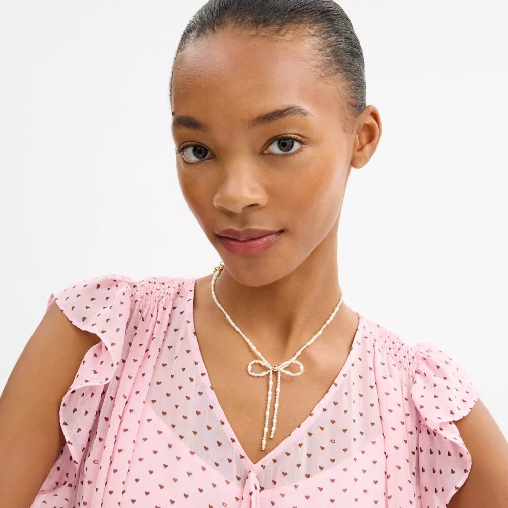 Collar gargantilla con lazo de perlas