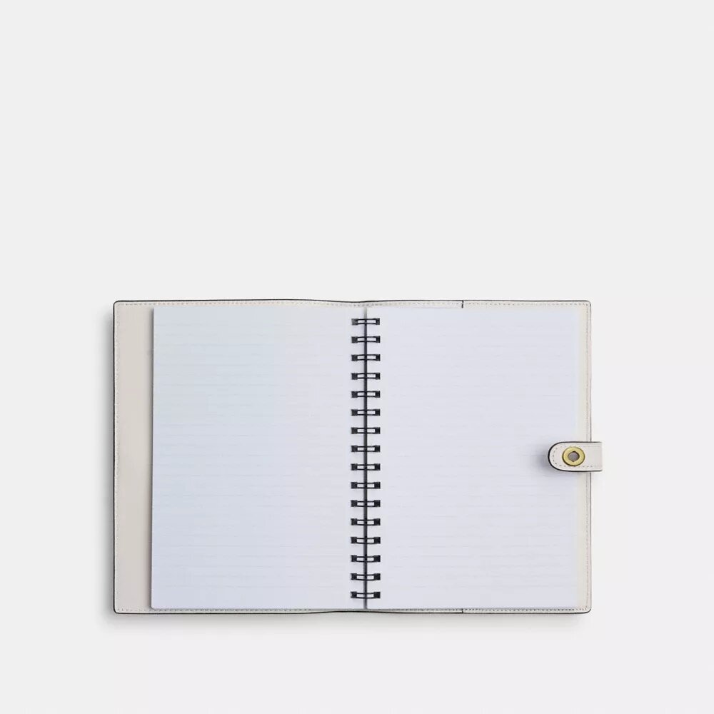 Cuaderno Disney x Coach con Pluto