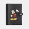 Cuaderno Disney X Coach de piel regenerativa con Mickey Mouse