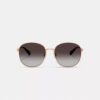 Gafas de sol redondas de metal con detalles dorados