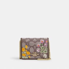 Mini cartera con cadena en jacquard exclusivo con bordado floral