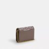 Mini cartera con cadena en jacquard exclusivo con bordado floral