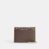 Mini cartera con cadena en jacquard exclusivo con bordado floral