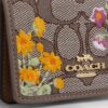 Mini cartera con cadena en jacquard exclusivo con bordado floral