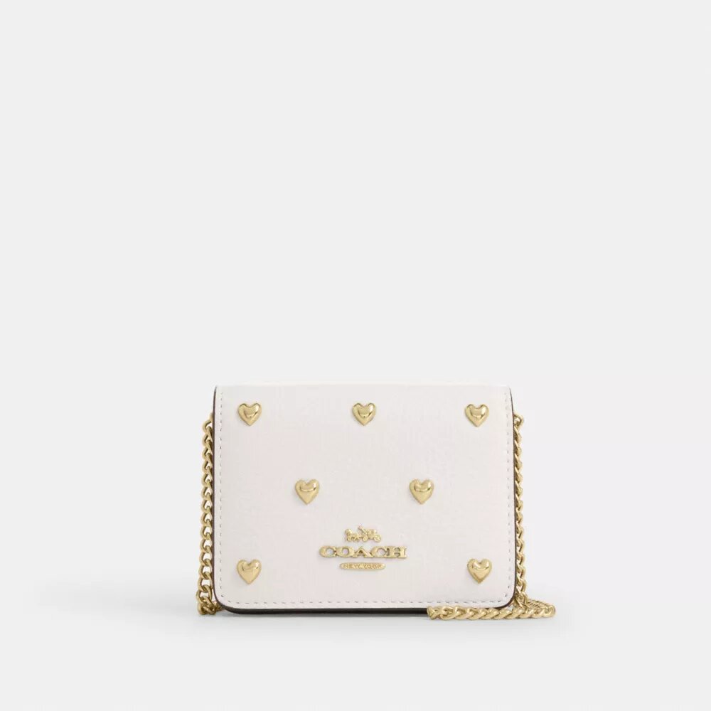 Mini cartera con cadena y remaches en forma de corazón