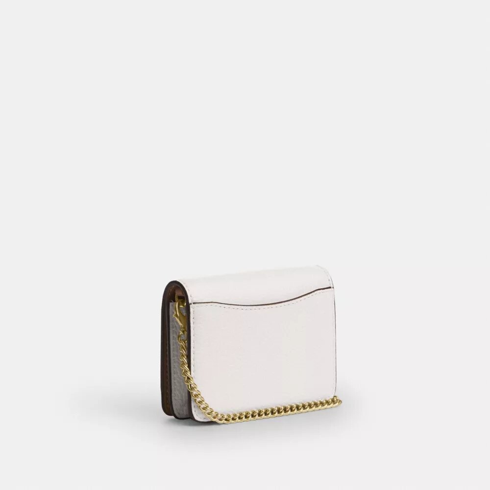 Mini cartera con cadena y remaches en forma de corazón