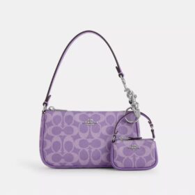 Mini colgante para bolsos Nolita en Signature Canvas