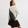 Mochila bandolera Dominic en Signature Canvas