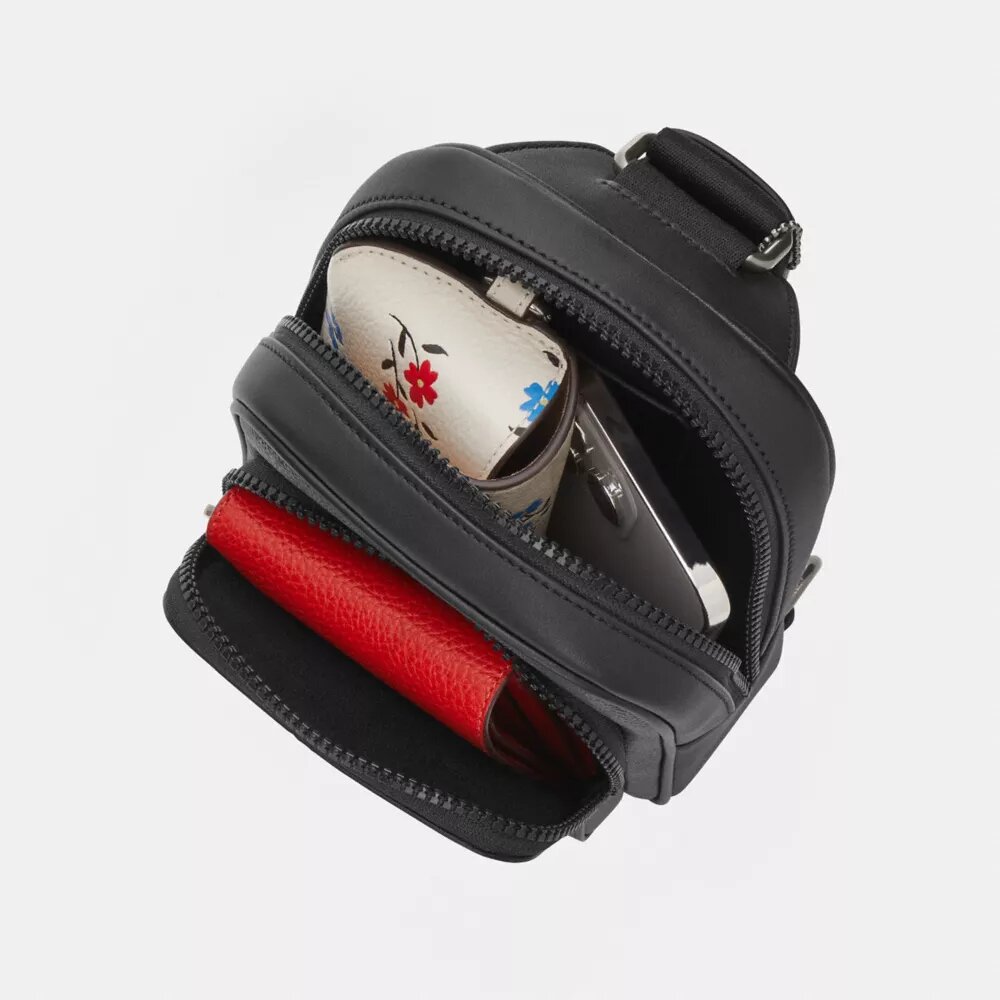 Mochila bandolera Racer en Signature Canvas