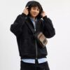 Mochila bandolera Racer en Signature Canvas