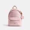 Mochila pequeña Taylor en Signature Canvas con Charms