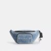 Riñonera Travis 35 en denim desgastado con Charms