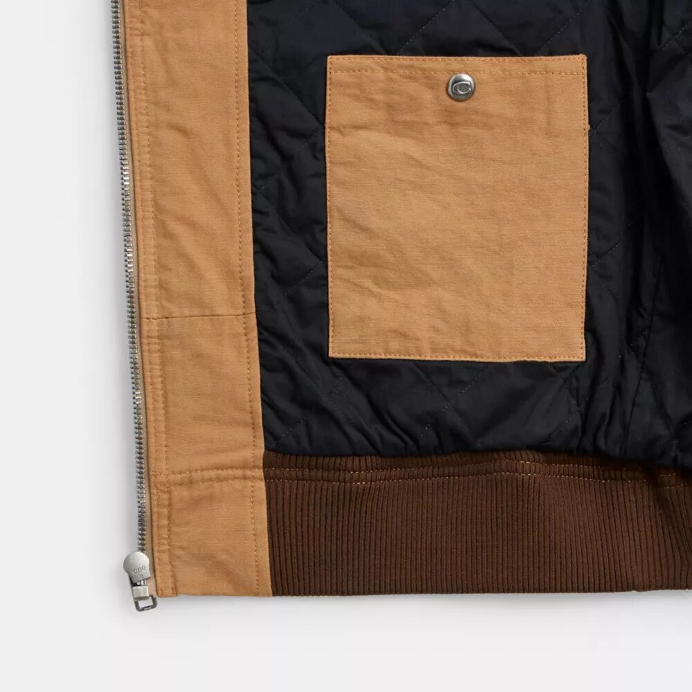 Sudadera con capucha y cremallera de lona