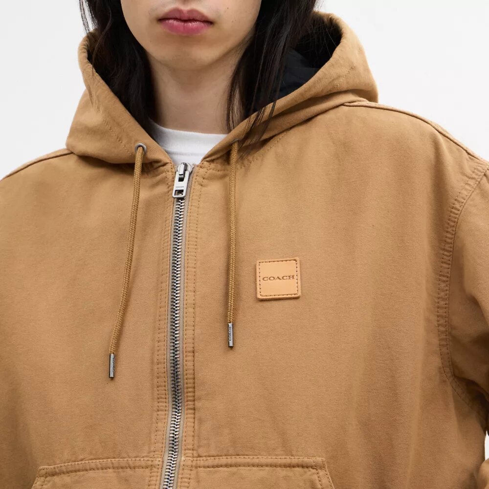 Sudadera con capucha y cremallera de lona