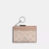 Tarjetero Mini Skinny en Signature Canvas