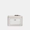 Tarjetero Mini Skinny en Signature Canvas