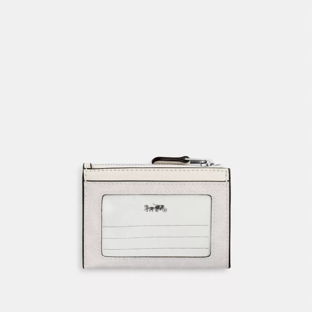 Tarjetero Mini Skinny en Signature Canvas