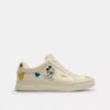 Zapatillas altas de Disney x Coach con estampado de pegatinas