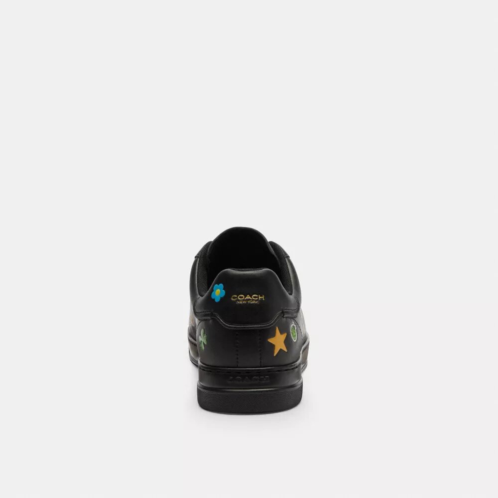 Zapatillas altas de Disney x Coach con estampado de pegatinas