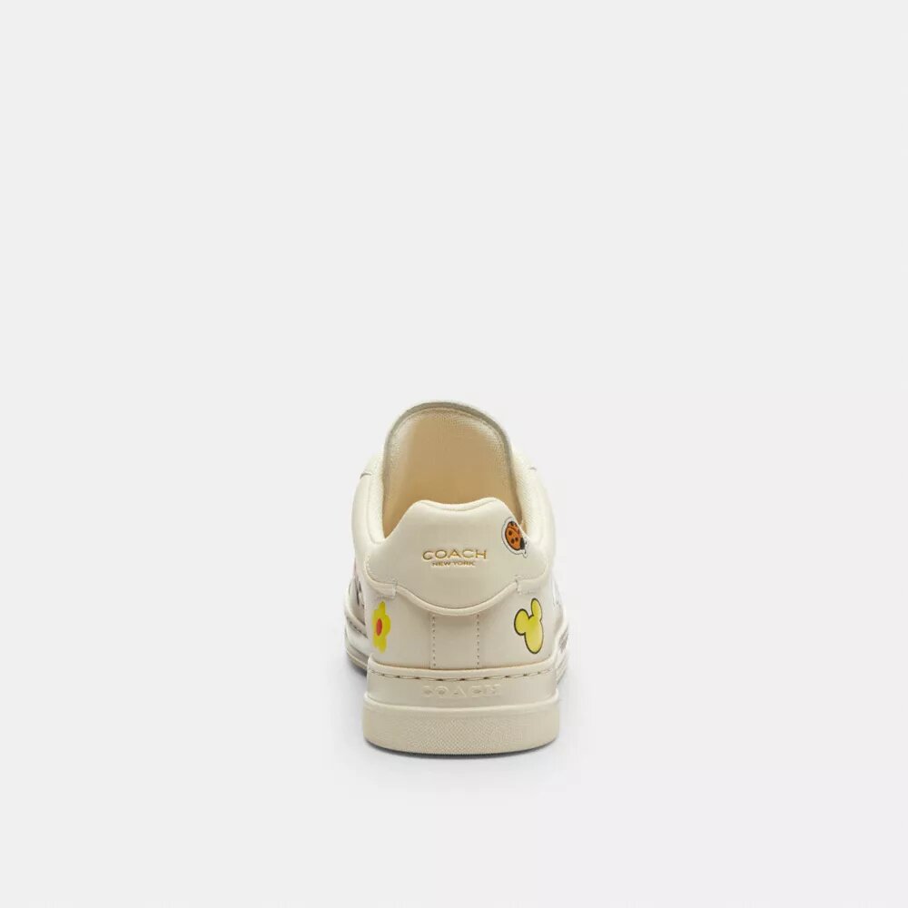Zapatillas altas de Disney x Coach con estampado de pegatinas