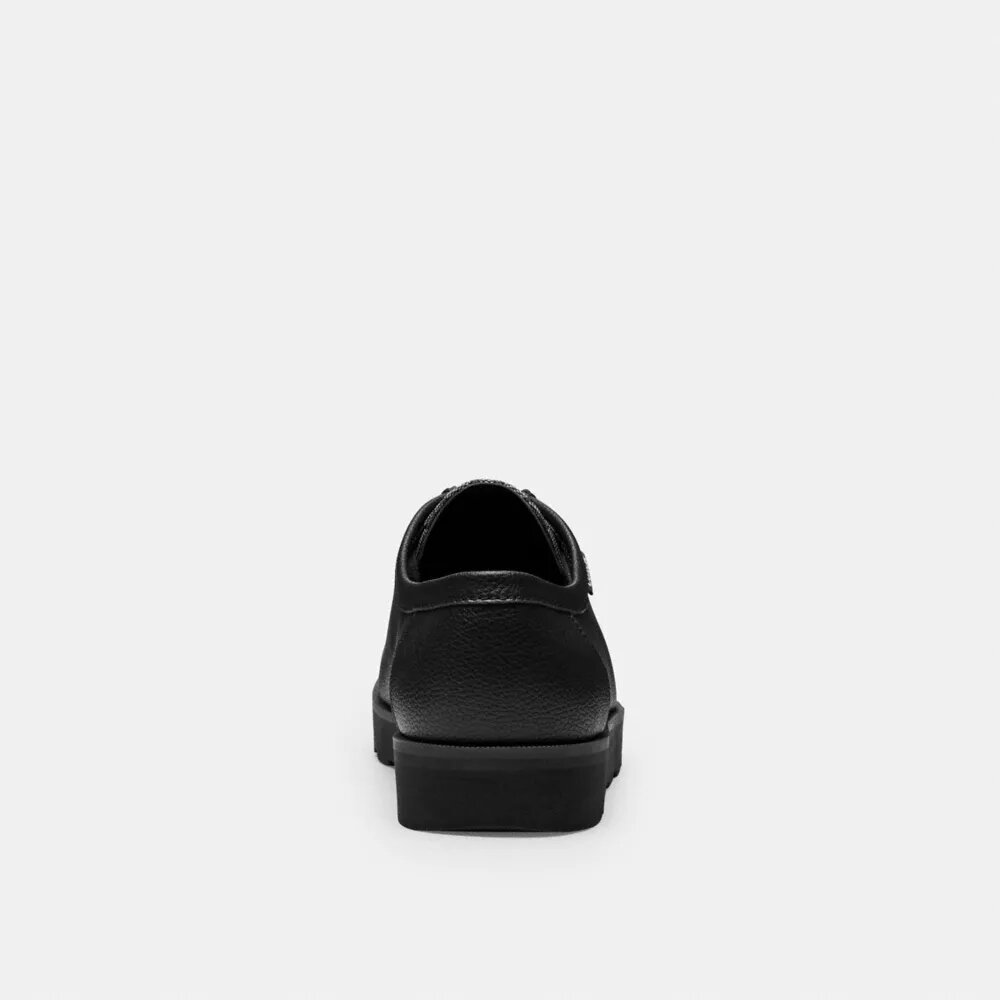 Zapatos chukka con Signature Canvas